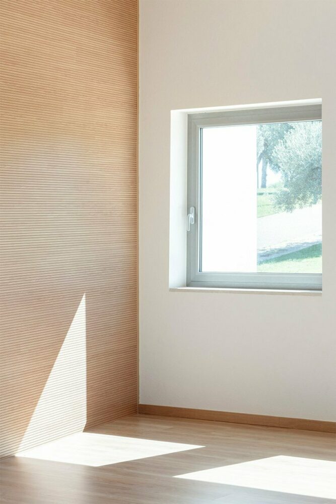 vibrant multipurpose room breathes new life into kindergarten in italy