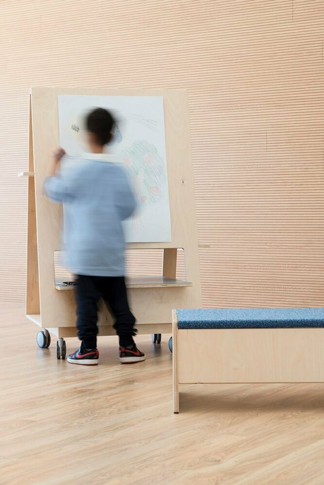 vibrant multipurpose room breathes new life into kindergarten in italy