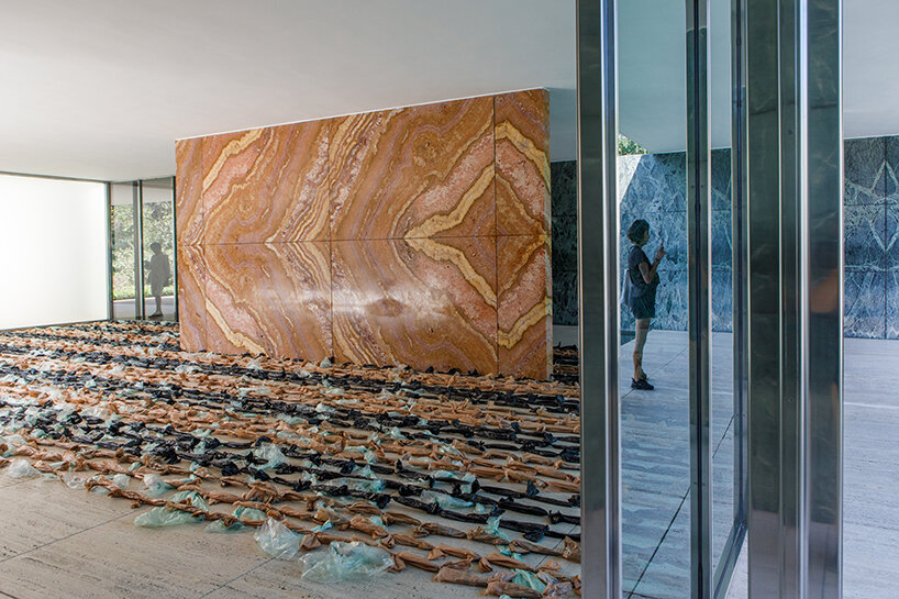endless plastic bags fill mies van der rohe’s barcelona pavilion to spotlight the cost of money