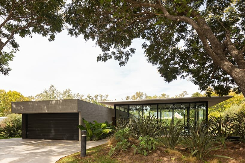 thin reinforced concrete sheet hovers above the glazed living room of house jp in argentina