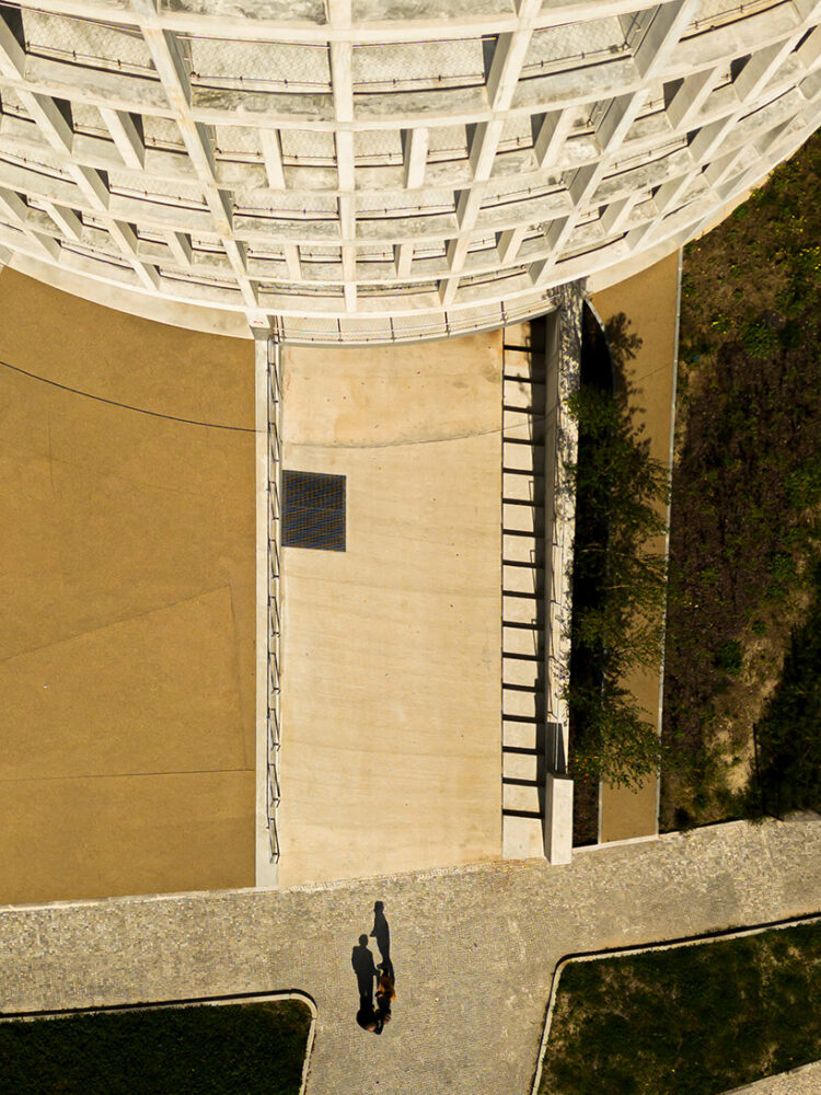 concrete pillars wrap around OODA’s cylindrical student housing tower in porto