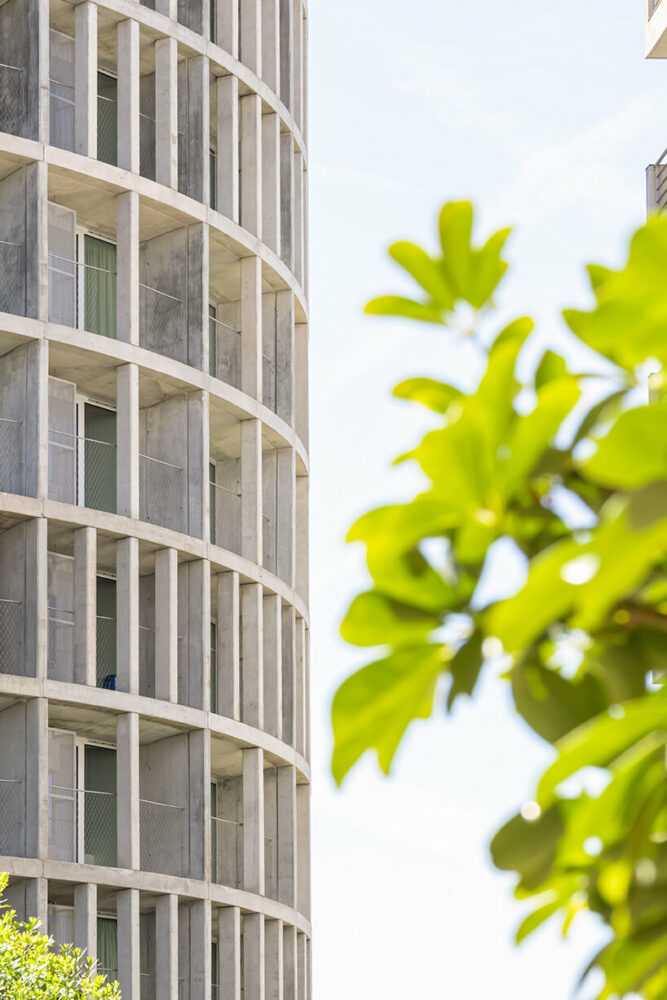 concrete pillars wrap around OODA’s cylindrical student housing tower in porto