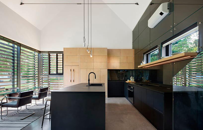 black reflective recyclable cladding coats pinkney neighborhood house in kansas