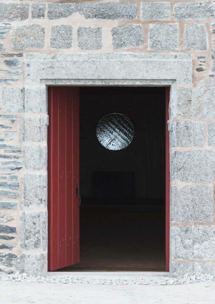 ronan bouroullec adorns restored chapel in monts d’arréel with minimal stone-sculpted altar