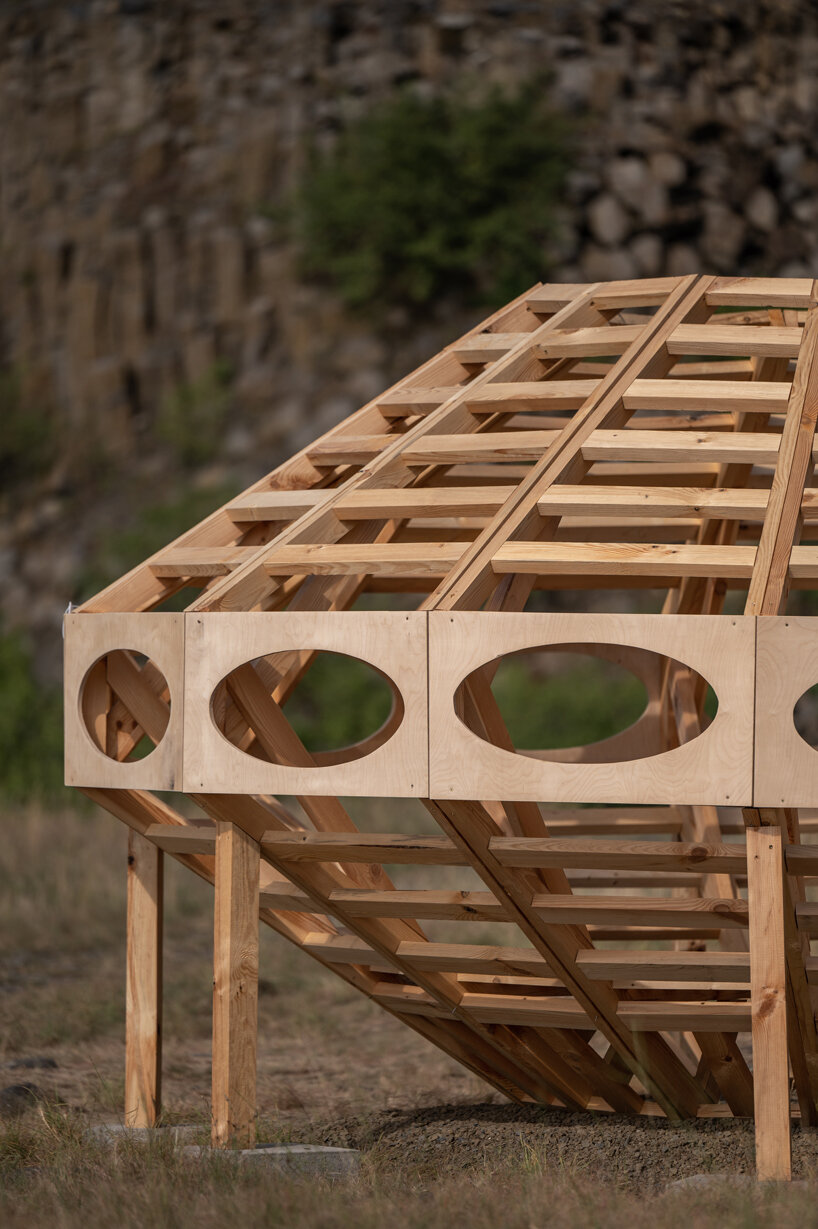 spaceship earth timber installation lands at hello wood festival in hungary