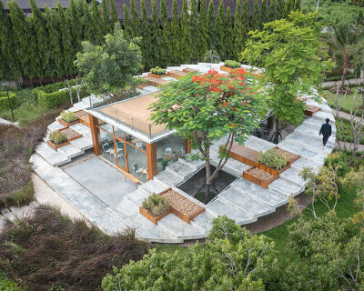 circular stepped concrete volume frames pomelo amphawa café in thailand