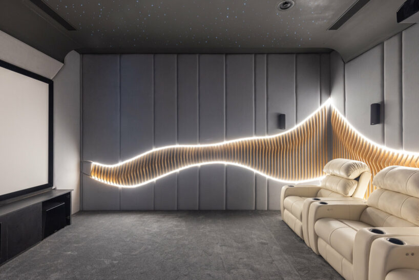 wooden ribs and LED lighting are strategically placed within the upholstered walls