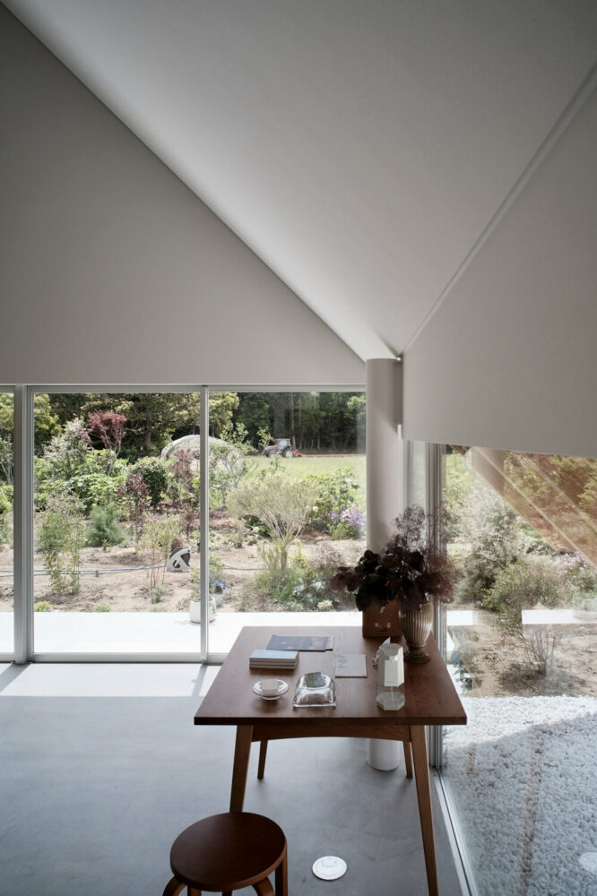 the interior enjoys views of the lush surroundings 