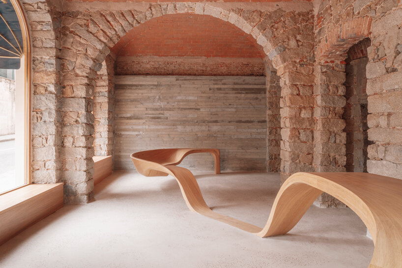 amelia tavella's curvilinear furniture-sculpture hybrid twists from seat to desk 