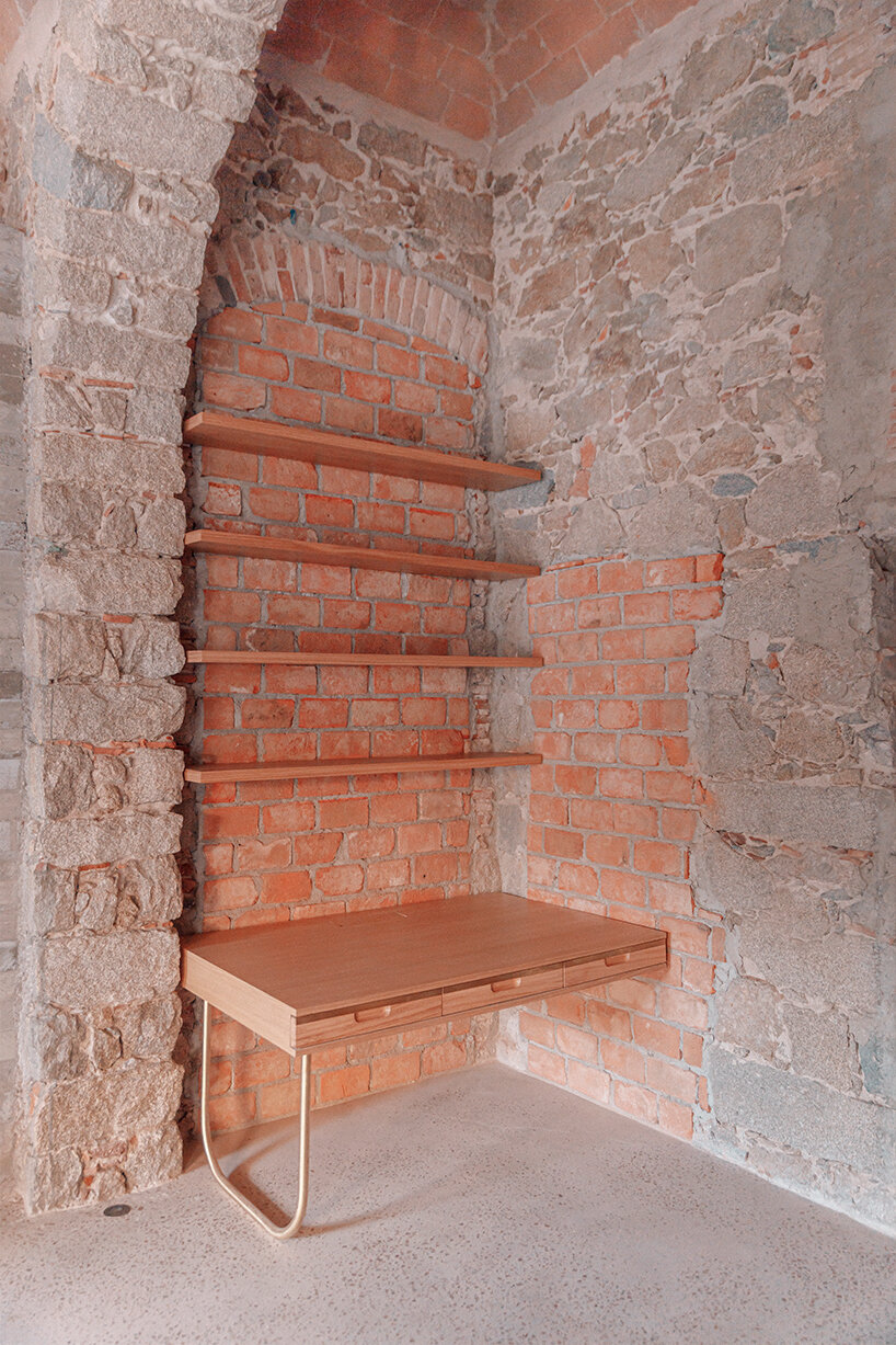 amelia tavella's curvilinear furniture-sculpture hybrid twists from seat to desk 