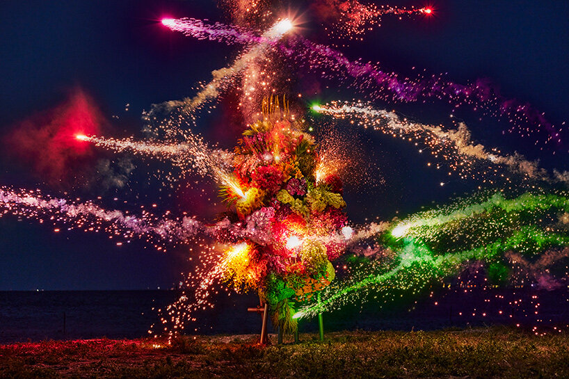 azuma makoto's botanical sculpture blossoms amidst colorful fireworks