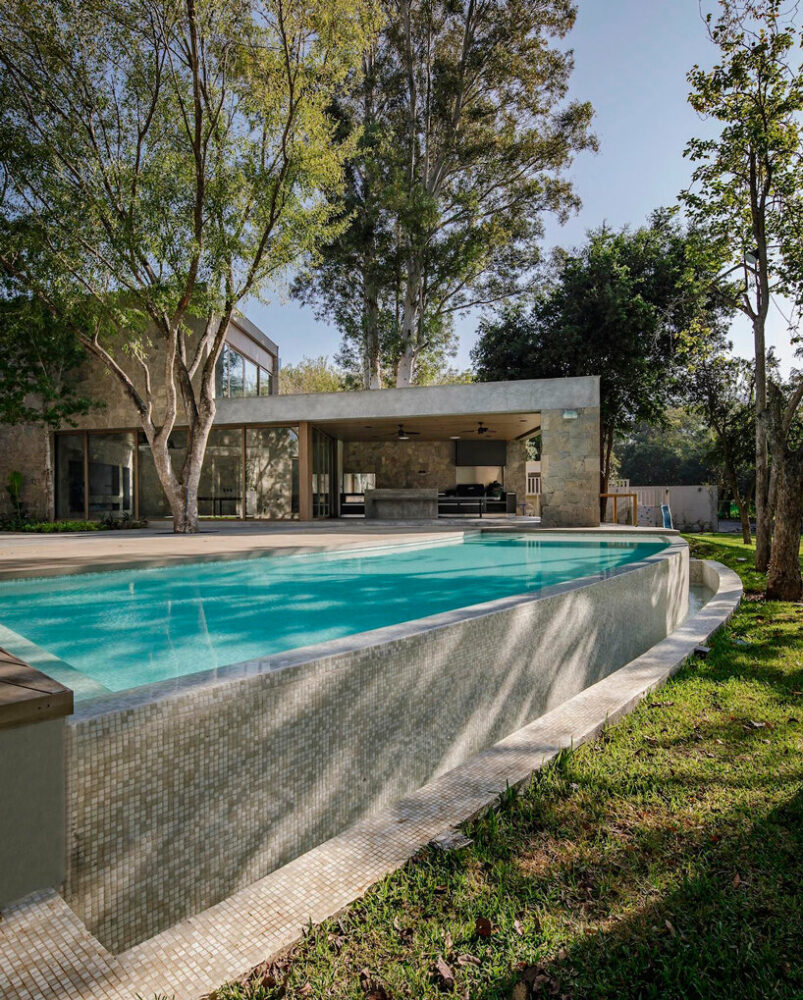 a curved pool follows the form of the layout's radial scheme