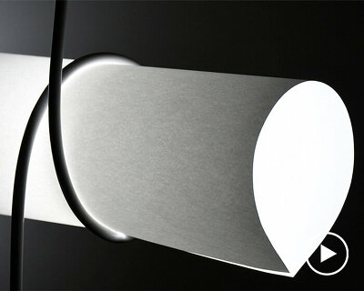 kazuhiro yamanaka fastens roll of A3 paper with power cable for playful lighting fixture