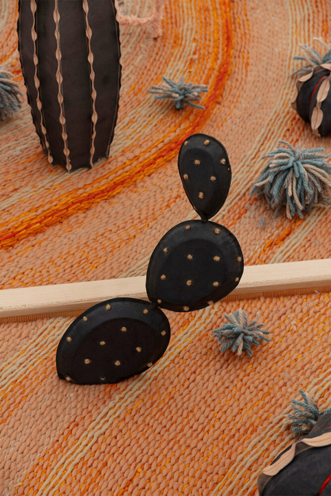 Invisible Exports (detail), 2023. Oxidized leather, wool, maple, Douglas fir plywood, denim, stainless steel. Installed: 9 x 71 x 44 inch. Photographer: Guillaume Ziccarelli. Courtesy of the artist and Perrotin.