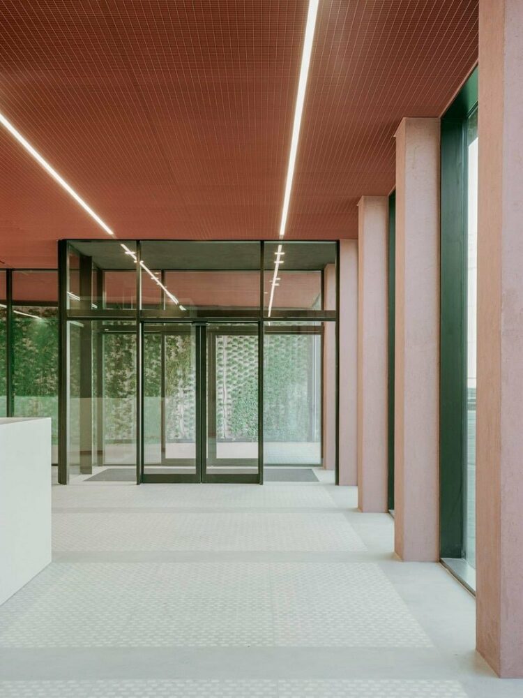 the glazed ground floor fosters a sense of connection and permeability to the neighborhood