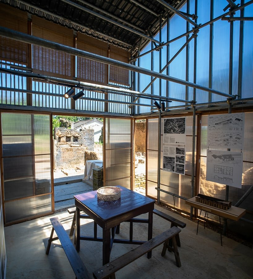metal scaffolding, timber-bamboo panels, polycarbonate infill compose the old house's interior