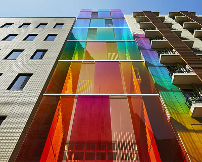 SAKO architects' vertical rainbow facade filters tokyo cityscape through vivd lens