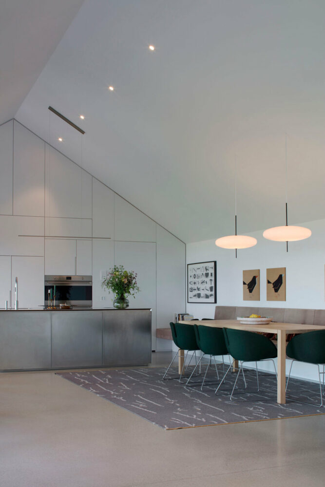 the intersection of the roof and the overall room height add a tangible dimension to the space