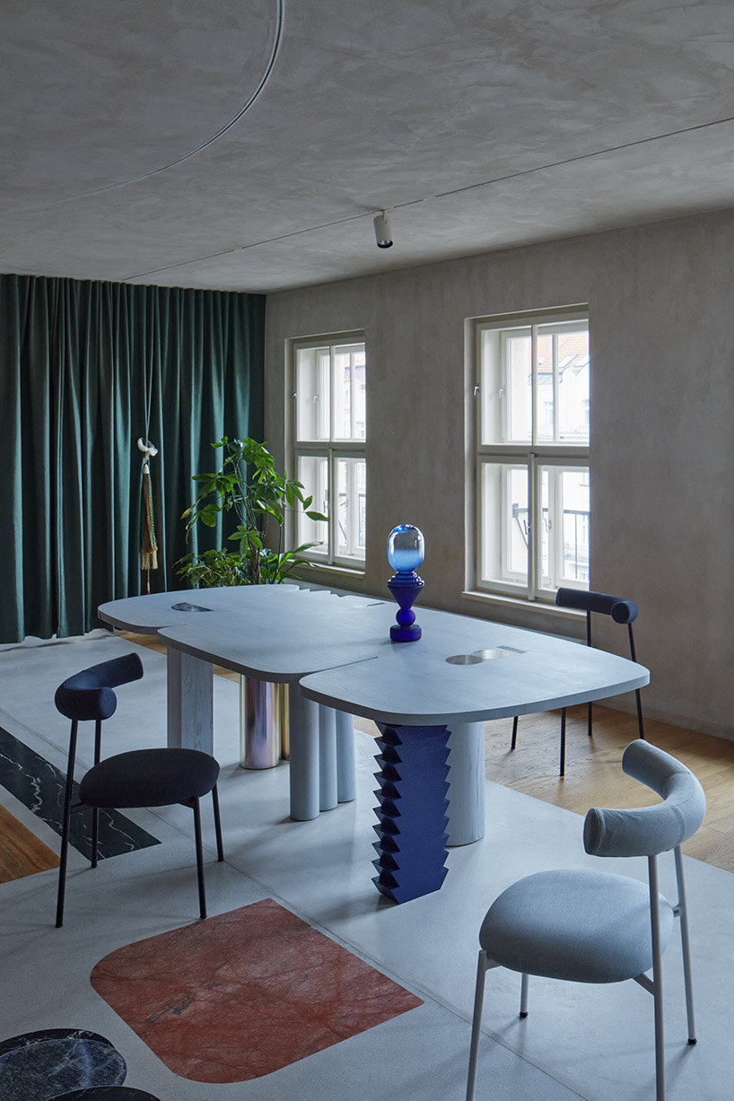 open-plan apartment in prague integrates hidden niches, arches & intricate patterns