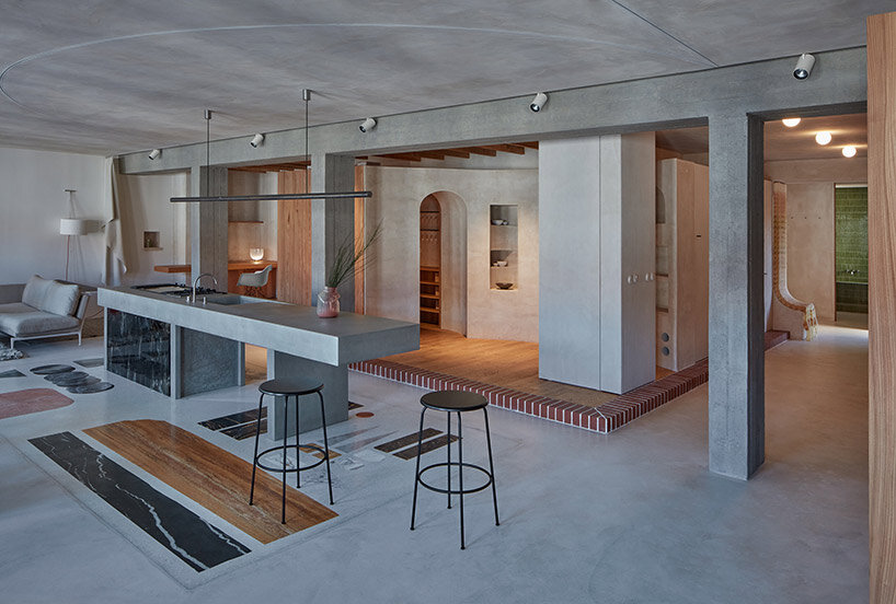 open-plan apartment in prague integrates hidden niches, arches & intricate patterns