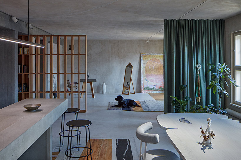 open-plan apartment in prague integrates hidden niches, arches & intricate patterns