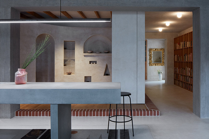 open-plan apartment in prague integrates hidden niches, arches & intricate patterns
