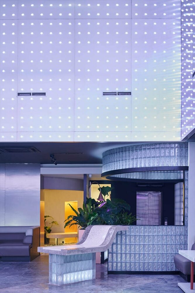 old cantilever structure is adorned with perforated stainless-steel cubes