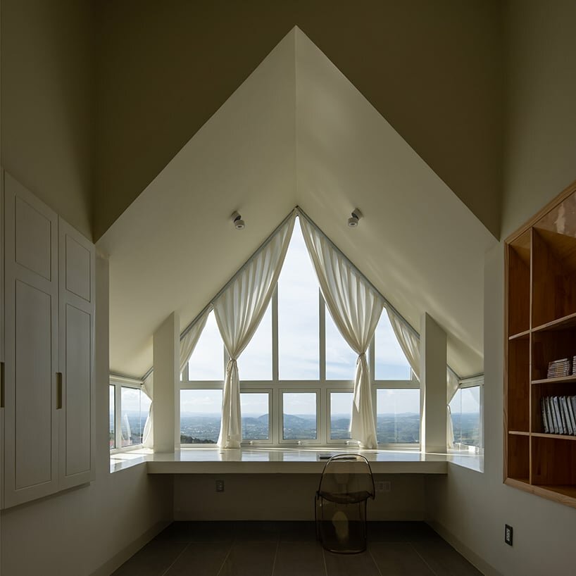 each bedroom enjoys views of the surrounding greenery