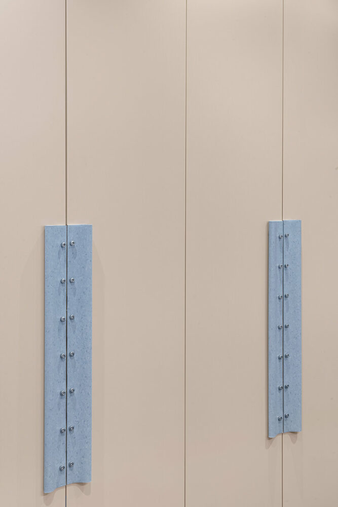 flooring material transforms into linoleum counter bases, work surfaces, and even lighting fixtures