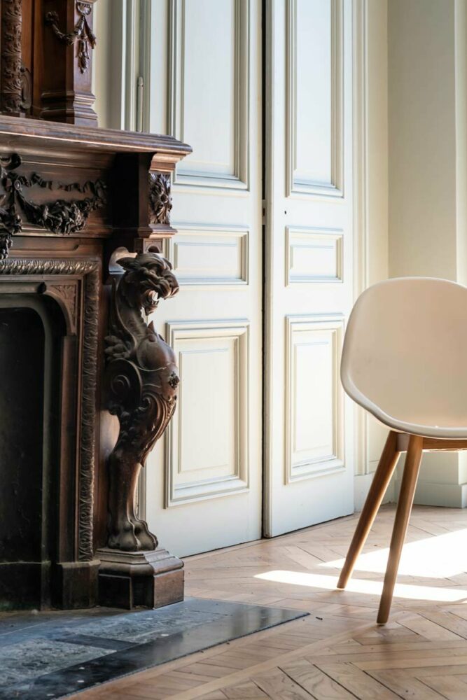 the fireplace's wood sculpture is a focal point of the sleeping area