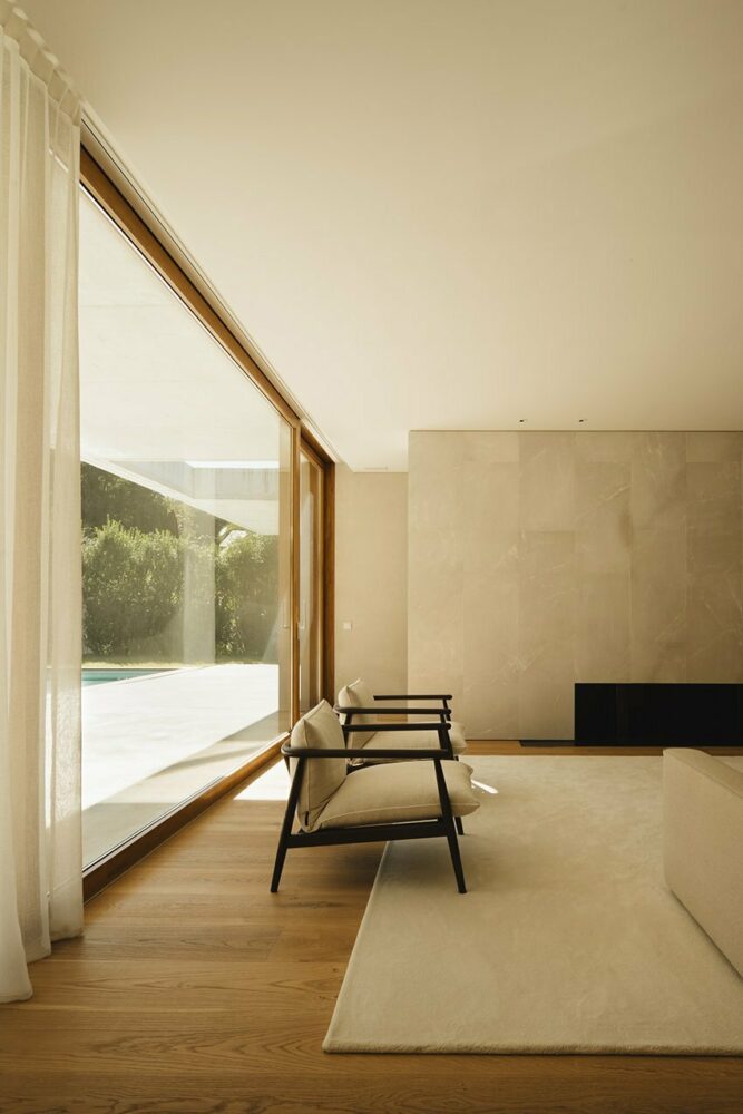 light beige clay plaster coats vertical surfaces as oak wood covers the floors and sliding doors