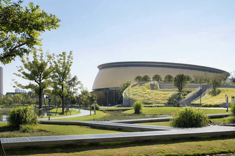archi-tectonics hybrid stadium in hangzhou takes cues from chinese cong