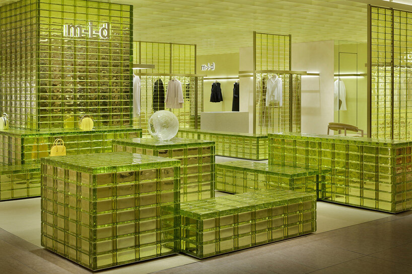 yellow glass bricks and louvers shape curiosity's labyrinthine concept store in osaka