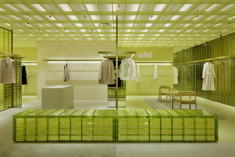yellow glass bricks and louvers shape curiosity's labyrinthine concept store in osaka