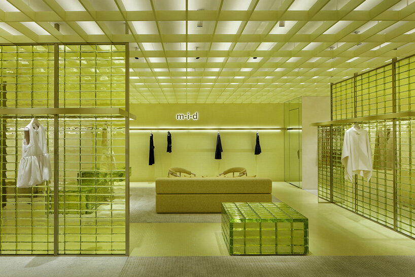 yellow glass bricks and louvers shape curiosity's labyrinthine concept store in osaka