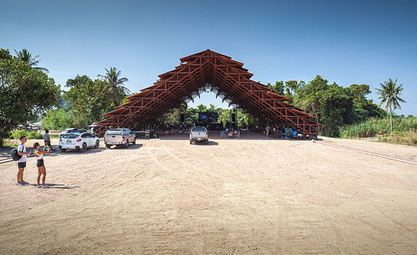 bangkok project studio constructs grand gable roof pavilion for thailand's festival
