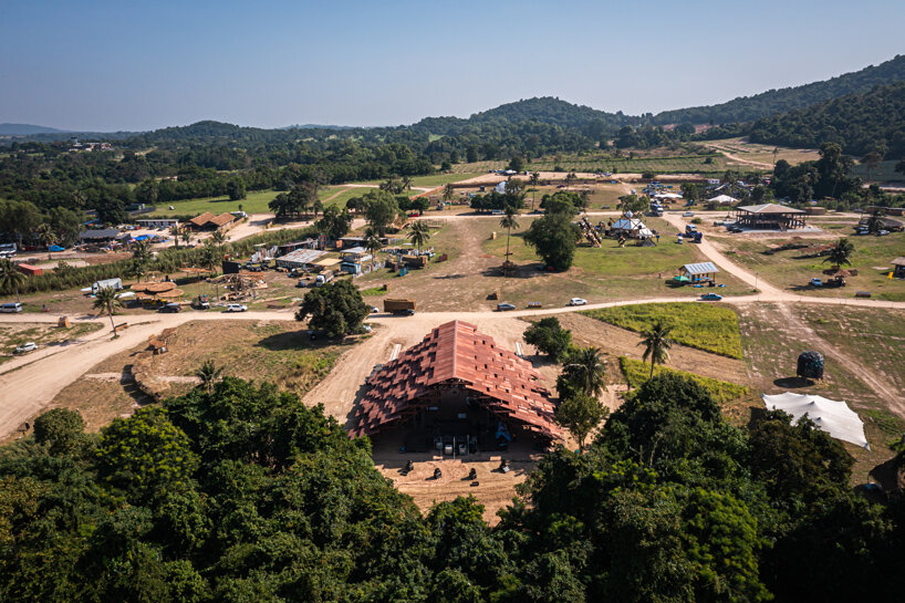 bangkok project studio constructs grand gable roof pavilion for thailand's festival
