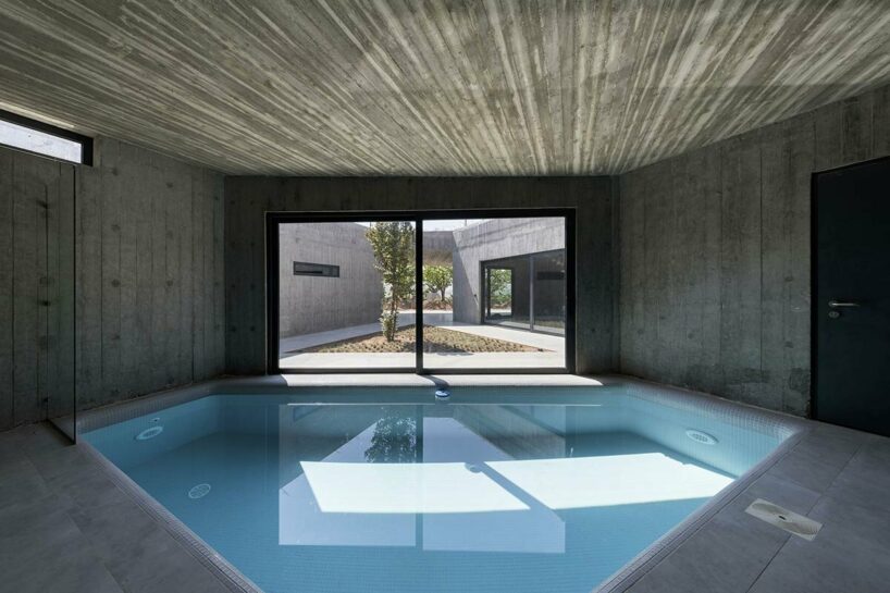 three cave-like structures are dedicated to communal and shared spaces, and a swimming pool