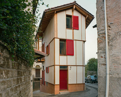 studio albori rebuilds this 'casa di legno e paglia' with larch wood and straw