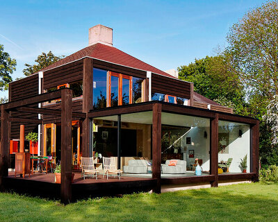 intertwined roofs crown mid 60's renovated structuralist house in the netherlands