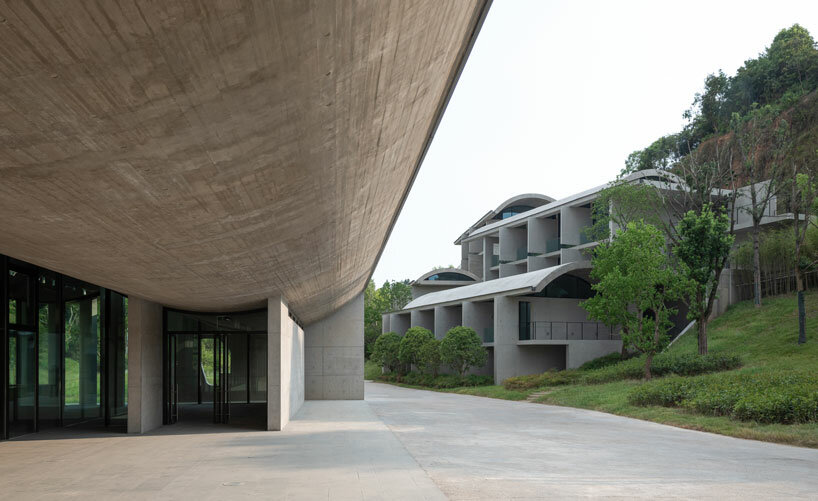 imposing inverted arches top studio zhu pei's international conference camp in china