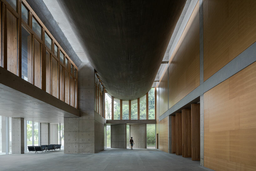 imposing inverted arches top studio zhu pei's international conference camp in china