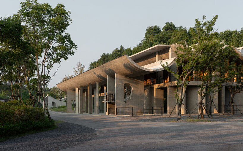 imposing inverted arches top studio zhu pei's international conference camp in china