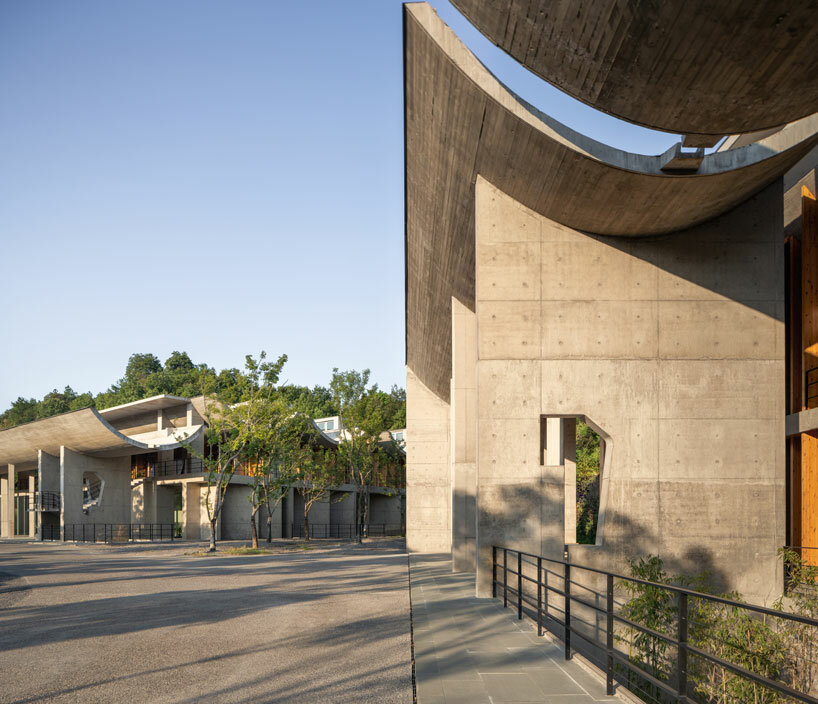 imposing inverted arches top studio zhu pei's international conference camp in china