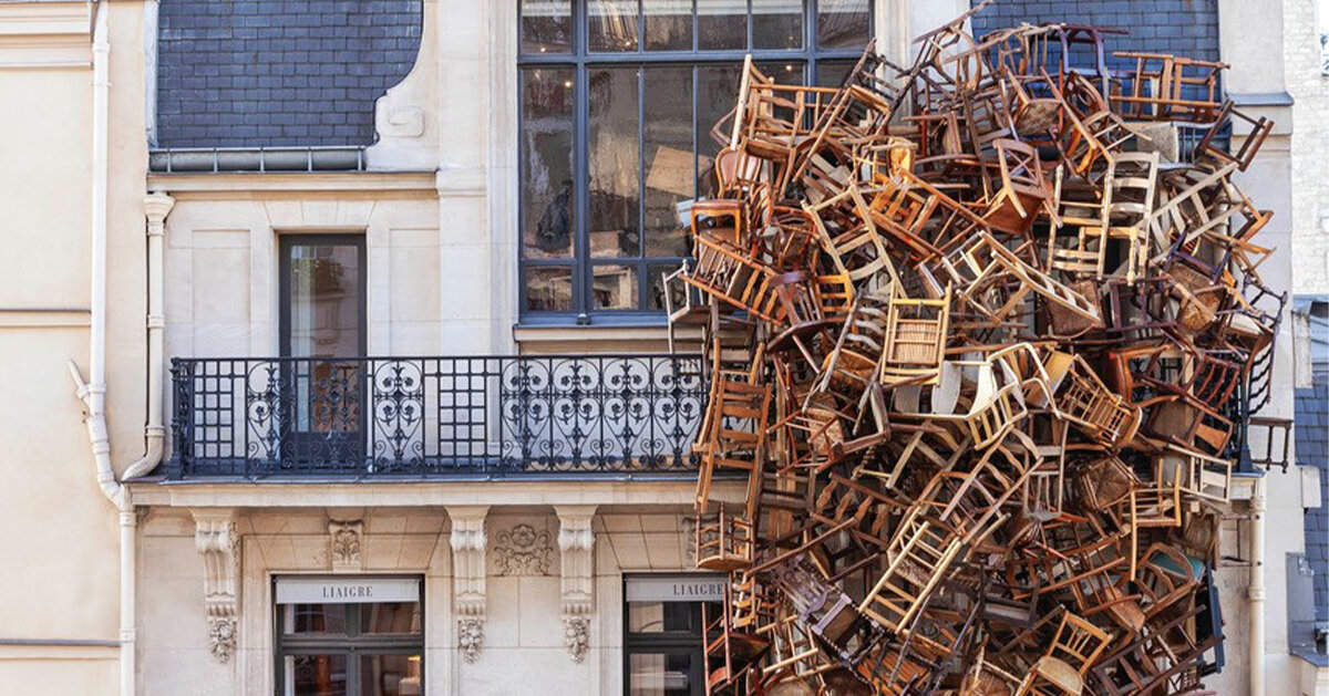 tadashi kawamata nests a tower of chairs onto liaigre's facade