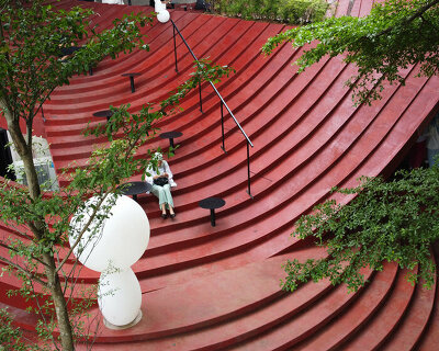 curved concrete steps outline RAD+ar's tanatap café in indonesia