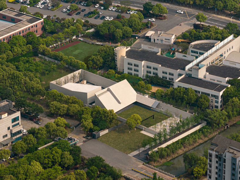atelier deshaus encloses taoyiqiu memorial hall in china with monumental walls