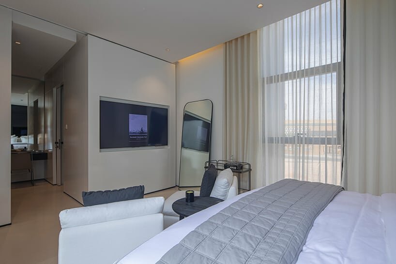 the design thoughtfully places bedrooms on the first floor, ensuring an abundance of sunlight