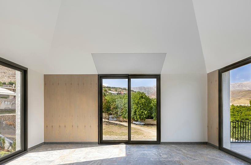 the rooms arrange large windows that offer views of the surrounding landscape