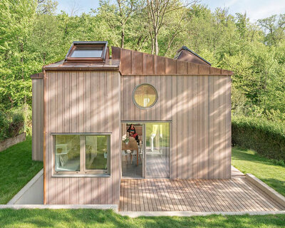 villa minimale in vienna comprises four identical wooden boxes in cross-plan configuration